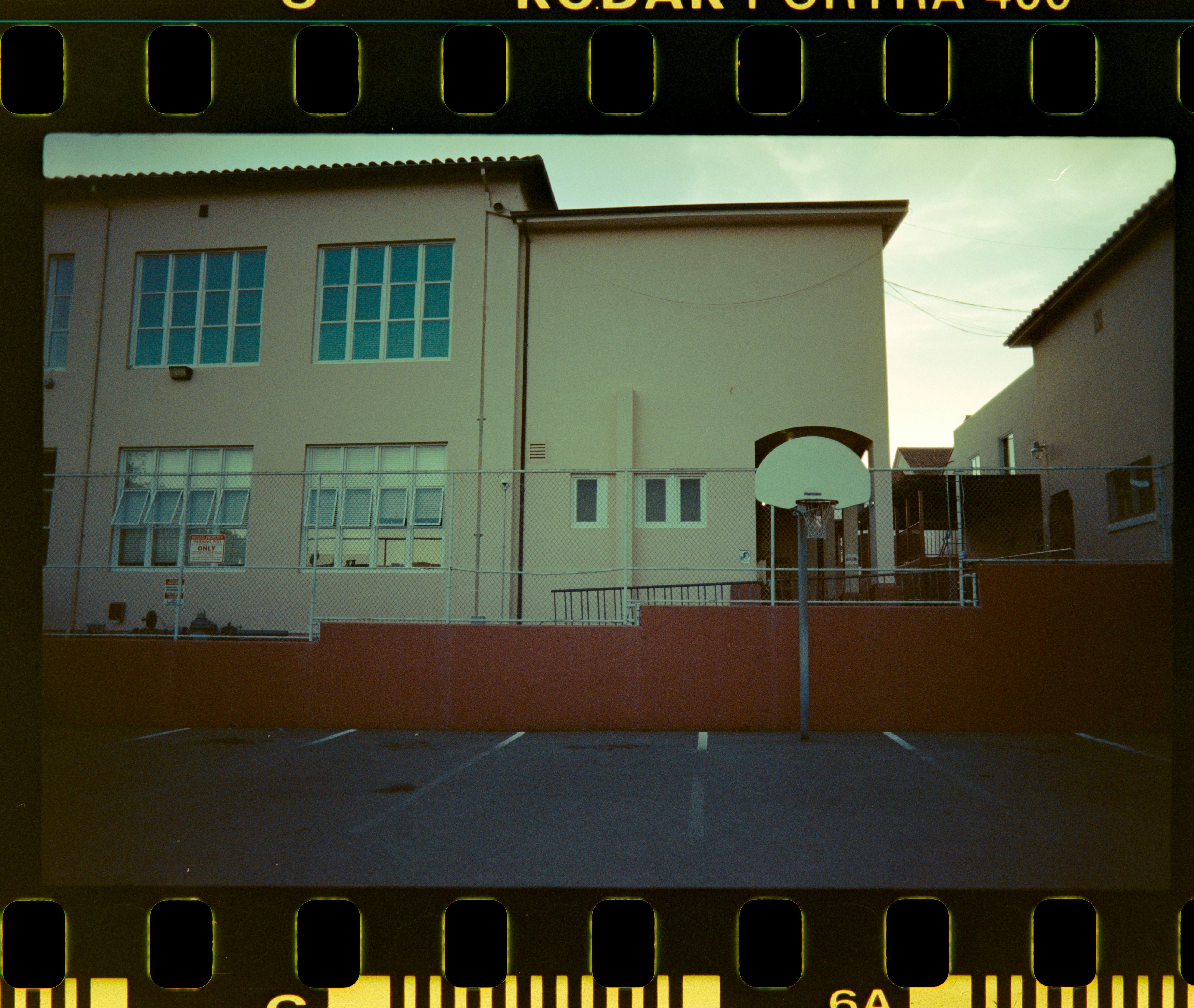 a picture of a building with a fence around it