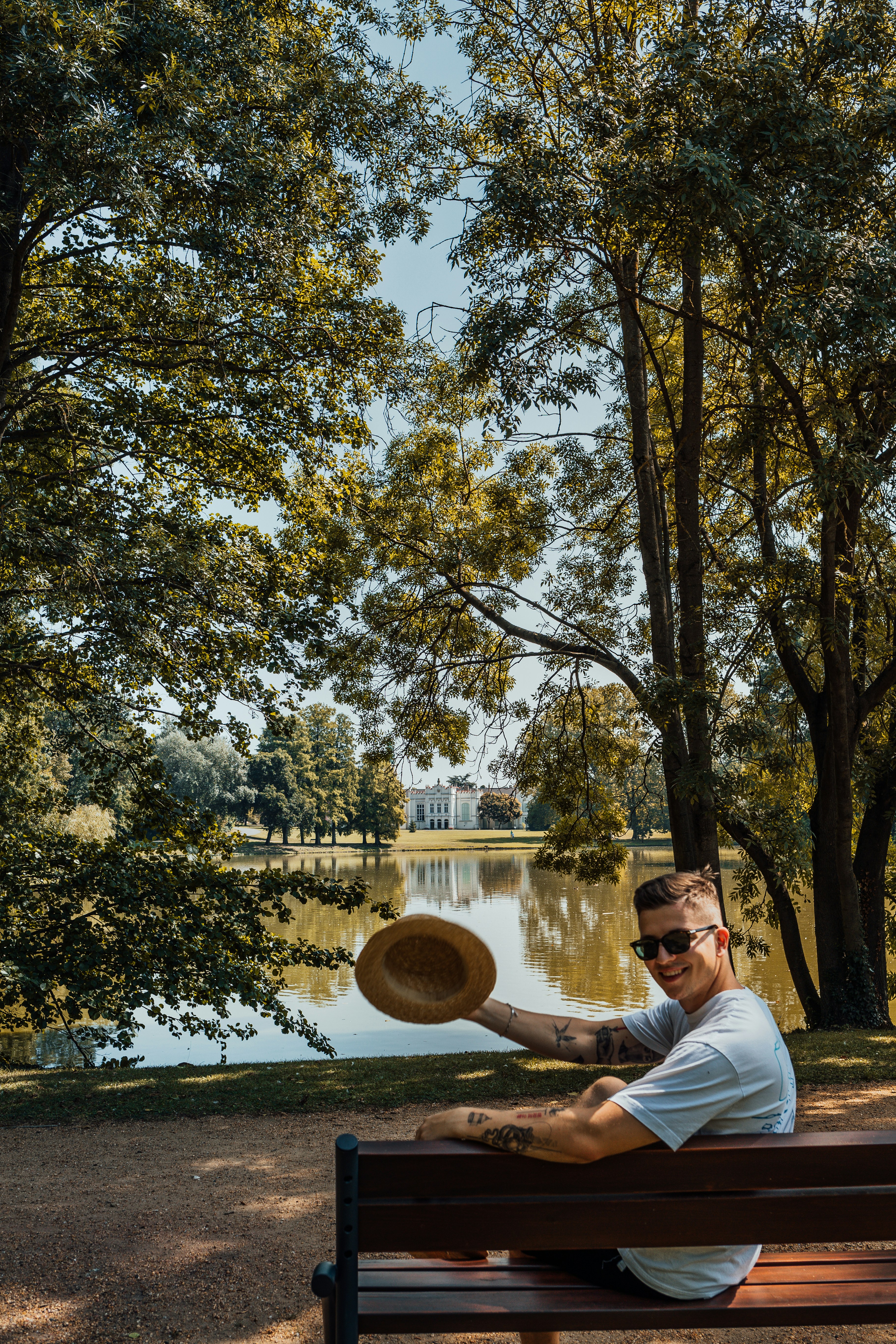 a man sitting on a bench with a frisbee in his hand