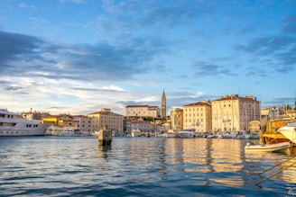 A scenic view of the Alicante coastline with boats in the harbor.