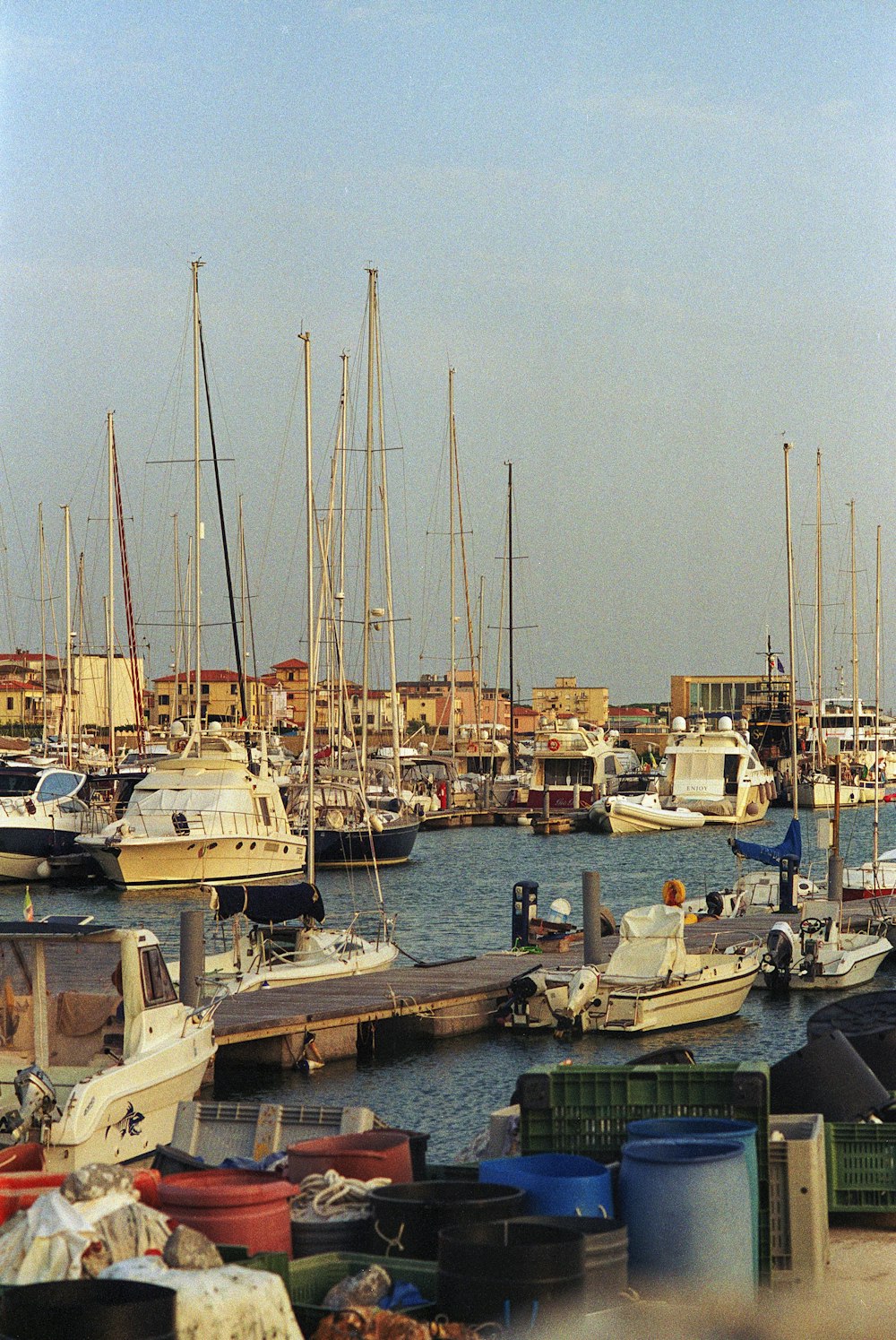 a harbor filled with lots of boats on top of a body of water