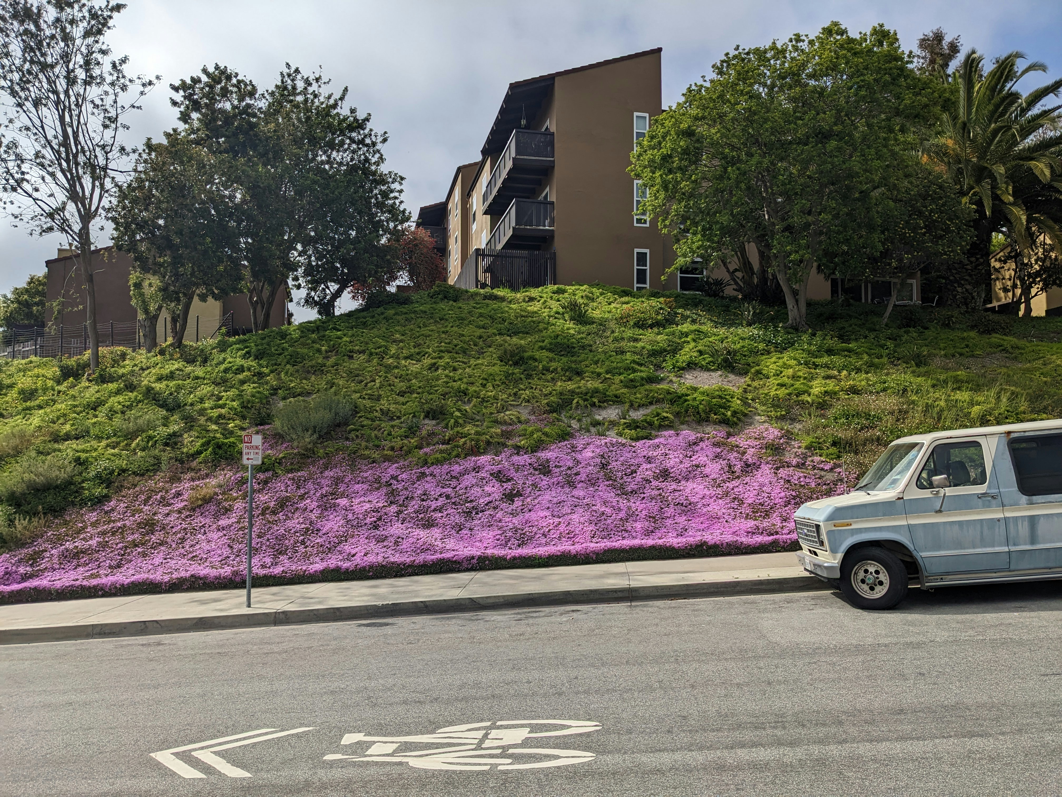 a van is parked on the side of the road
