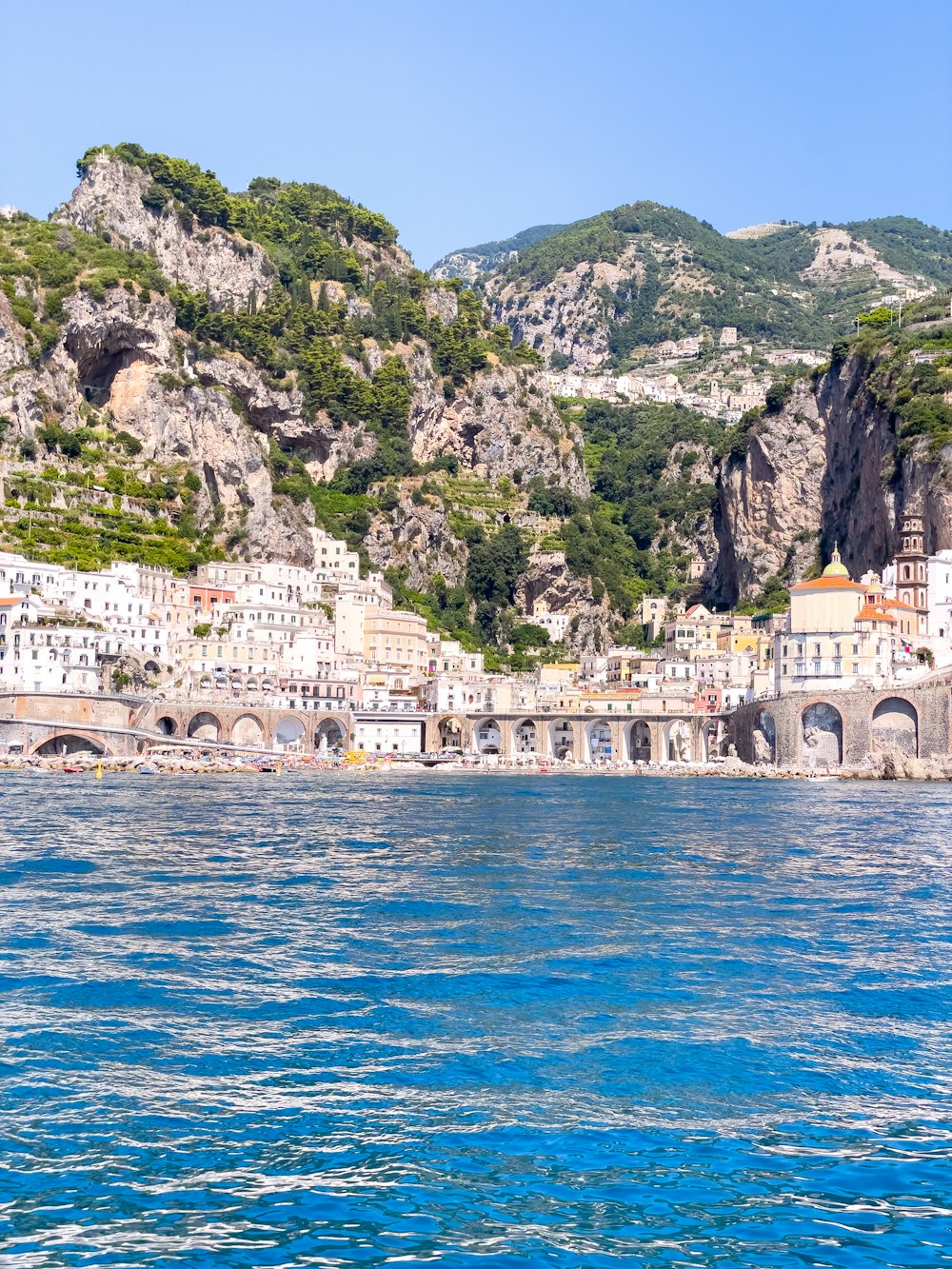 a body of water with a bunch of buildings on the side of it