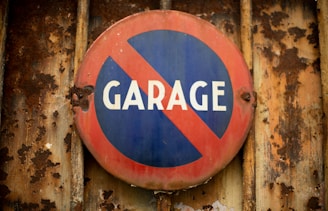 a red and blue sign that says garage on it