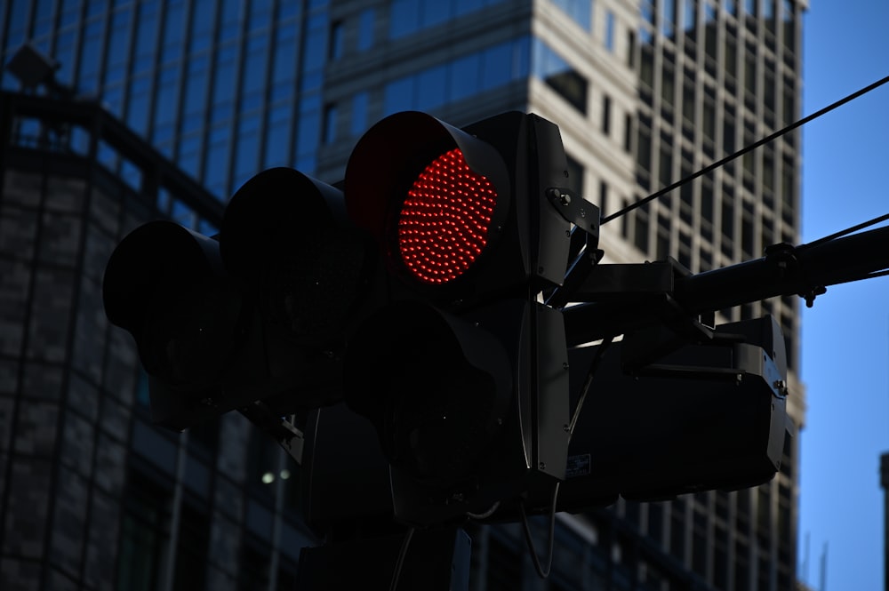 a traffic light with a building in the background