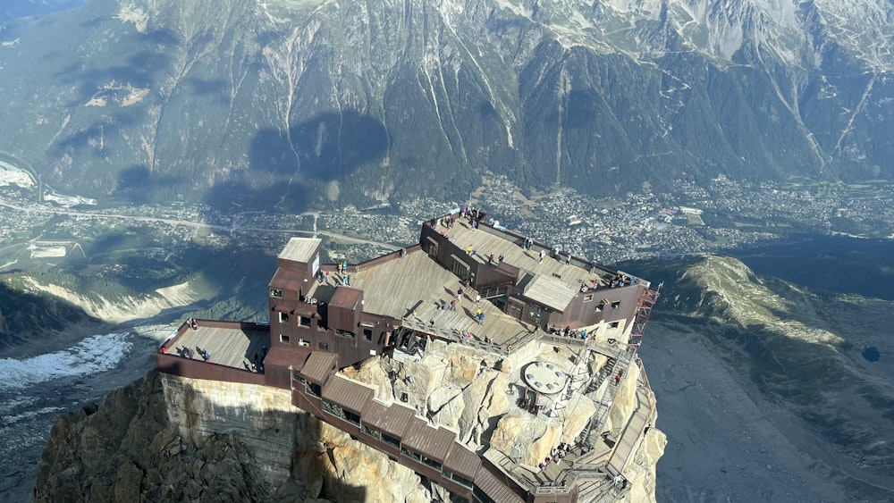 an aerial view of a castle on a mountain