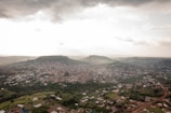 An aerial view of a bustling city surrounded by nature.