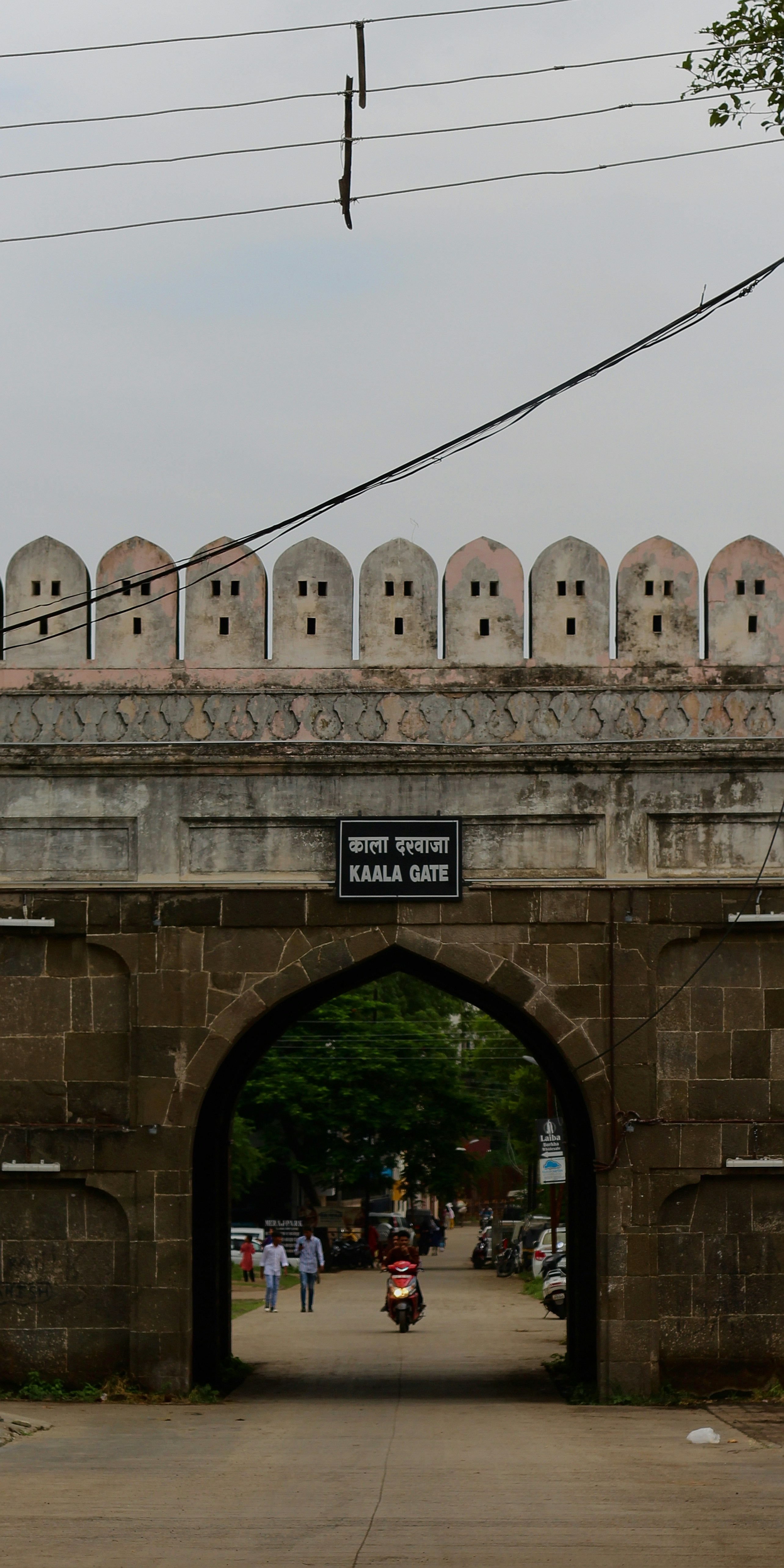 a stone bridge with a sign on it