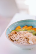 A bowl of nutritious food with fruits and grains.