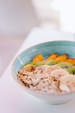 A bowl of nutritious food with fruits and grains.