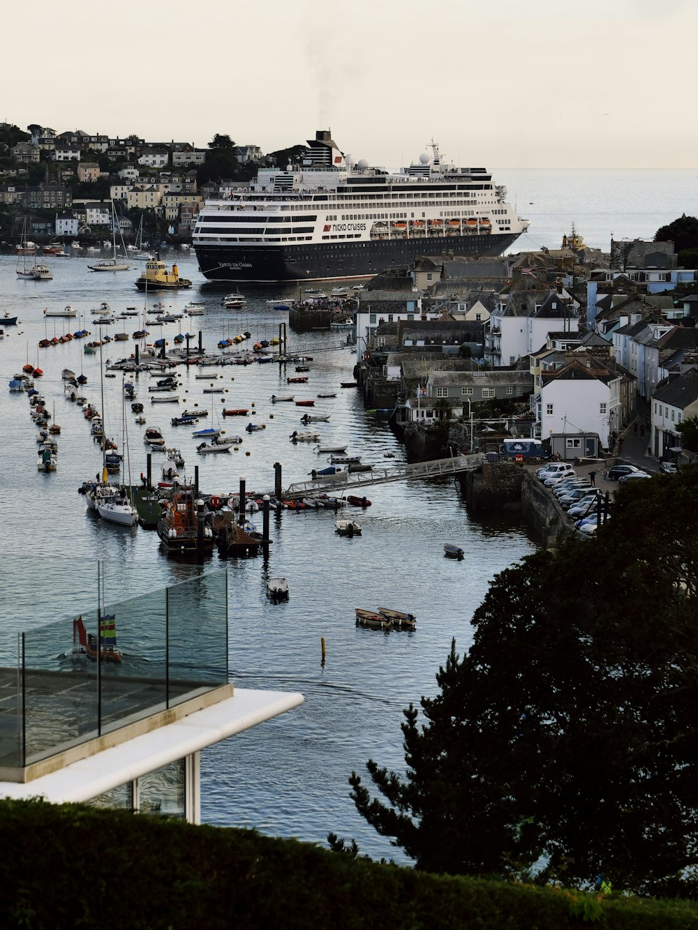 a large cruise ship is docked in a harbor