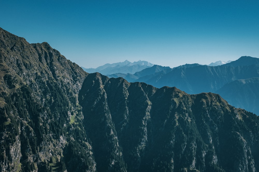 a view of a mountain range from the top of a mountain