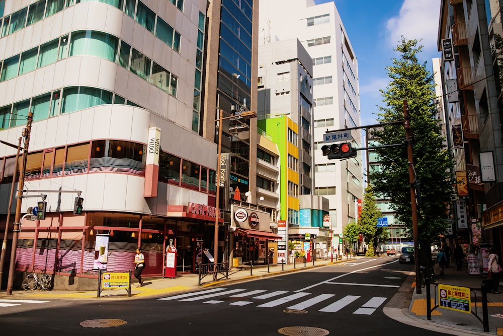 a city street filled with lots of tall buildings