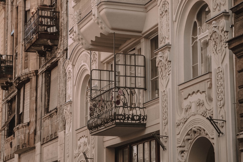a building with a wrought iron balcony and balcony balconies