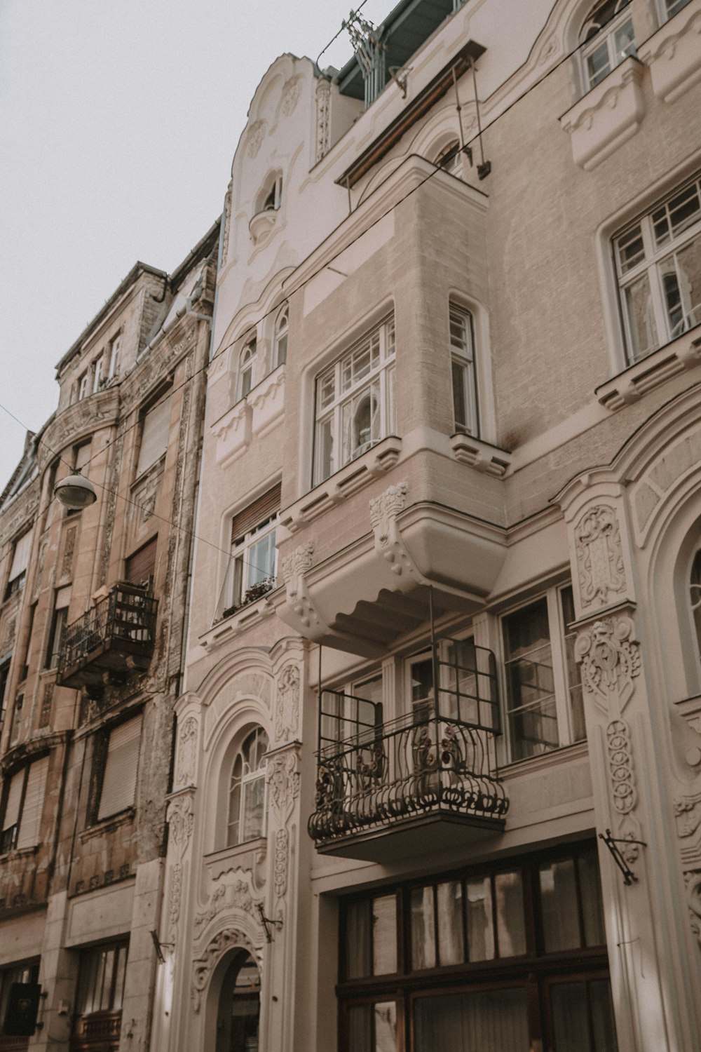 a tall building with a balcony and balconies