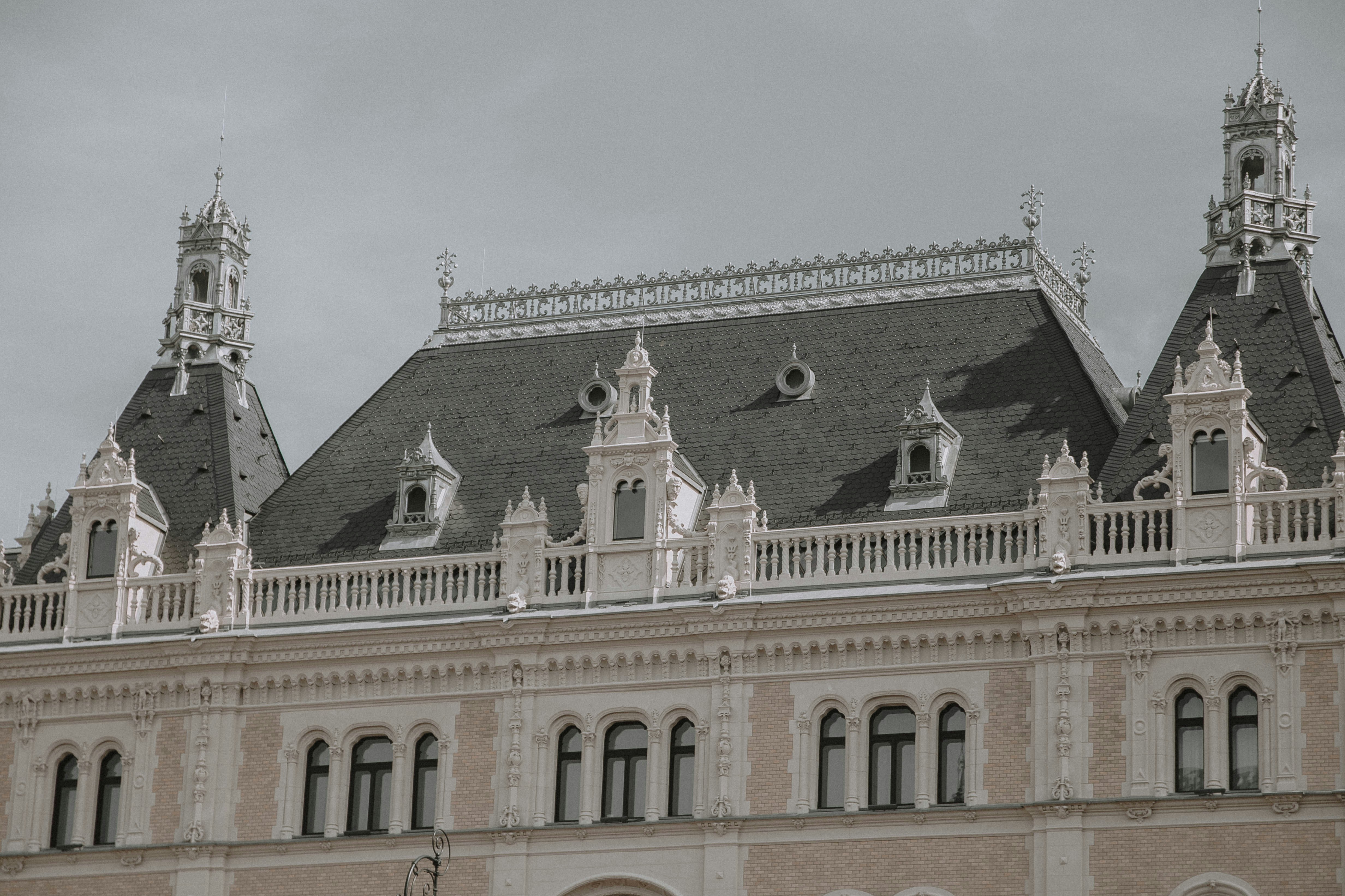 a large building with two clocks on each of it's sides