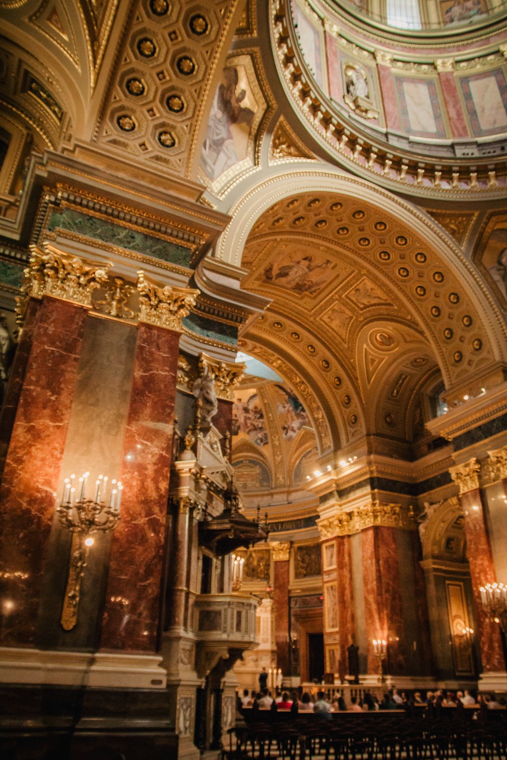 a large room with a ceiling and a chandelier