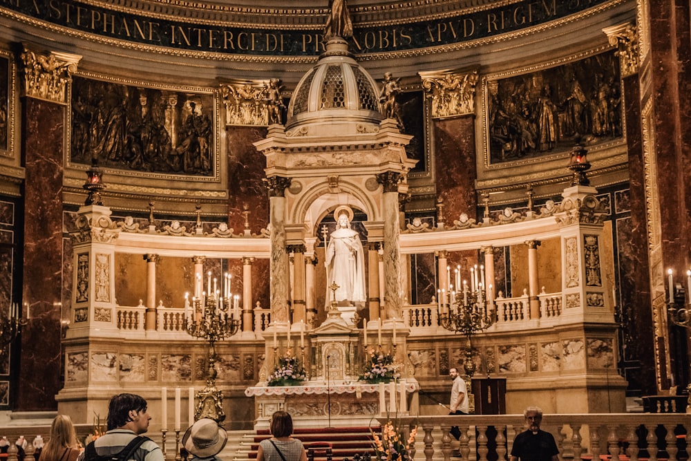 a group of people standing in front of a church alter