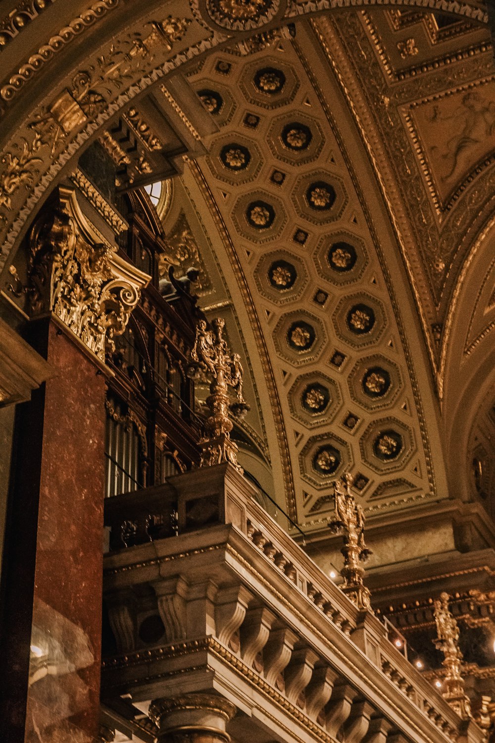 a large ornate building with a clock on the wall