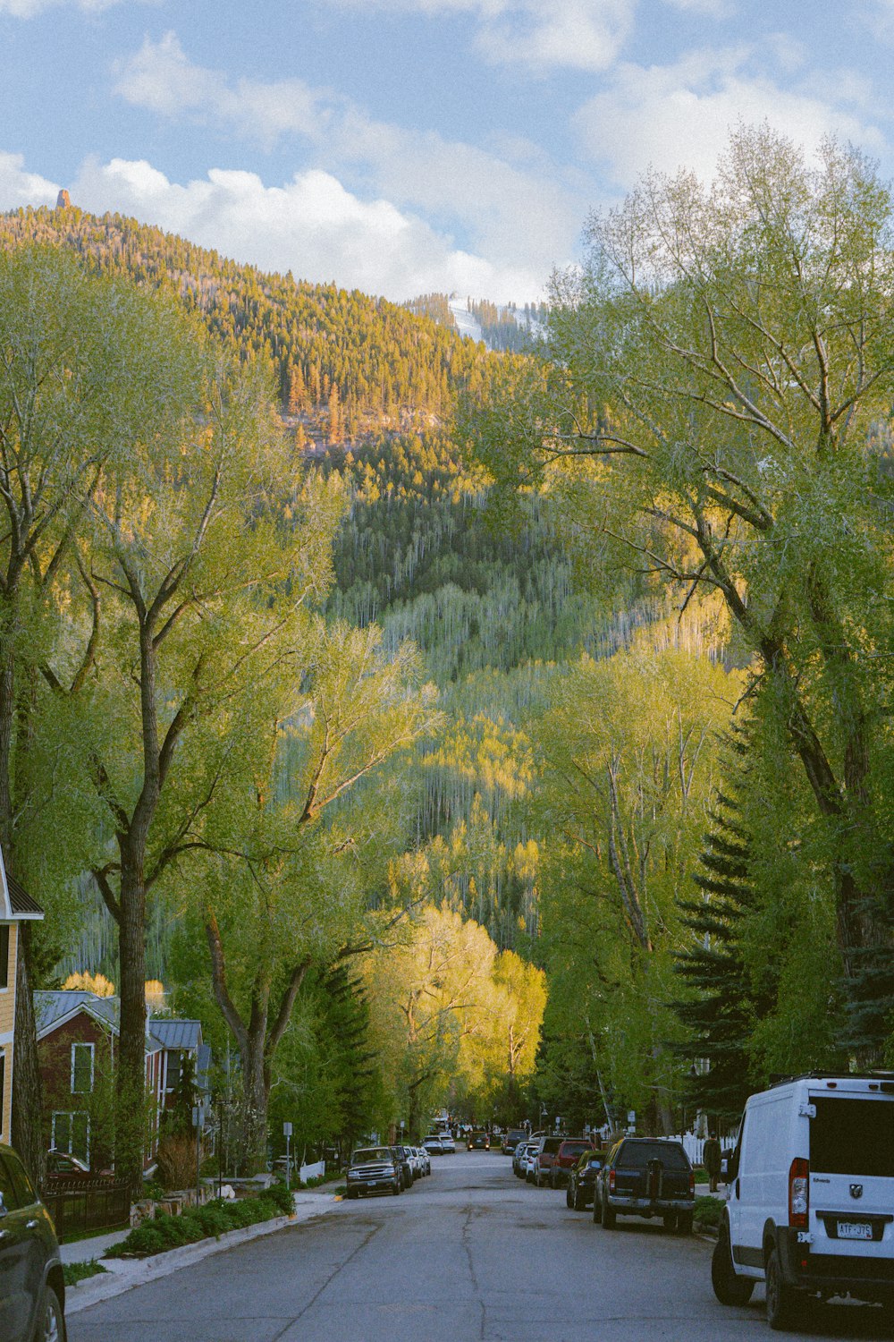 a street with cars parked on the side of it