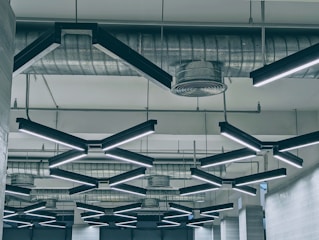 Close-up of a modern ceiling installation showcasing smooth textures and copper accent lighting.