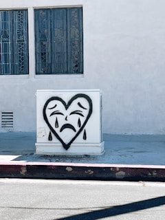 a white box with a heart drawn on it