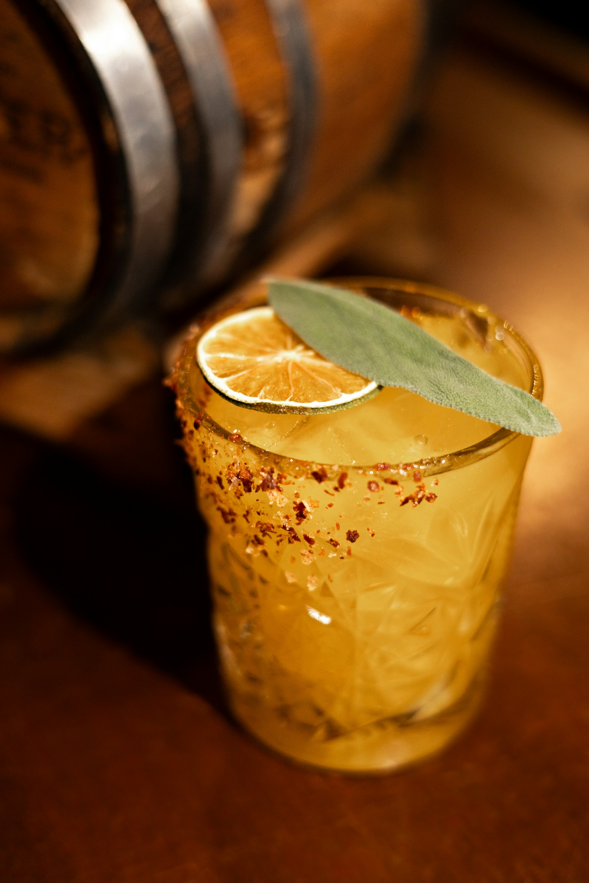 a close up of a glass with a slice of lemon