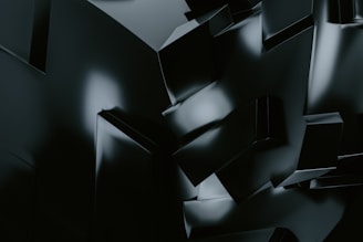 Isometric abstract geometric shapes carved into a solid surface with subtle shadows, reflecting technical depth.