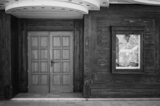 Image showing the installation of a wooden door frame inside a modern home.