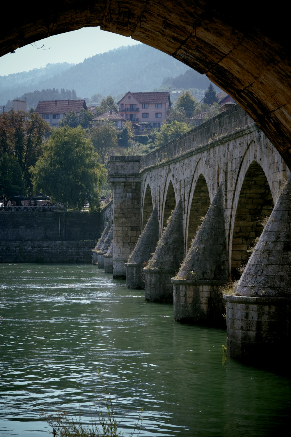 a view of a bridge over a body of water