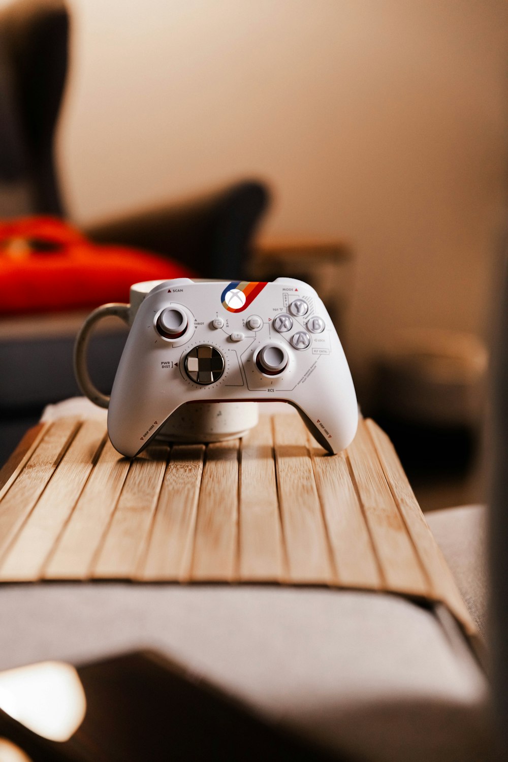 a white controller sitting on top of a wooden table