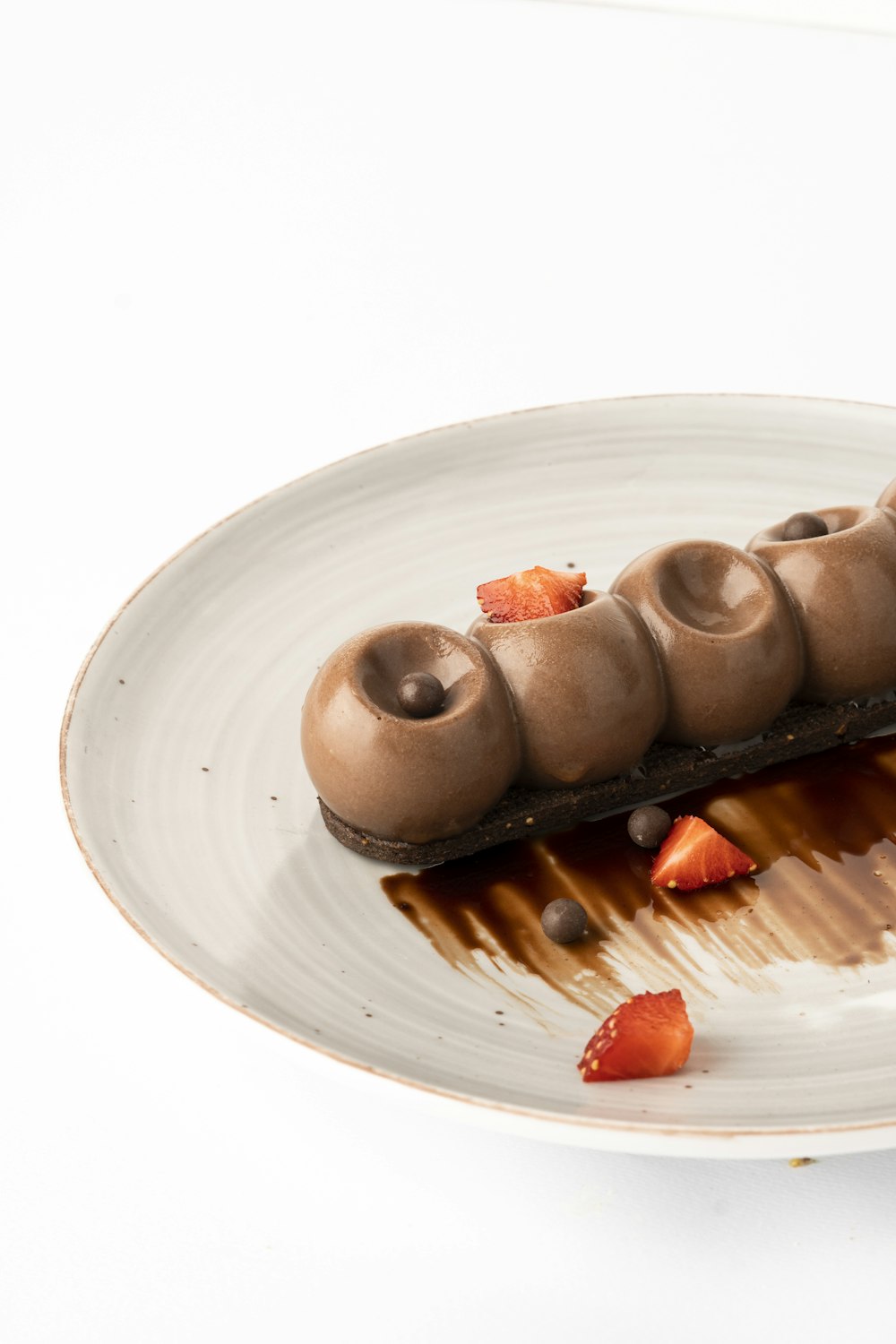 a white plate topped with a chocolate dessert