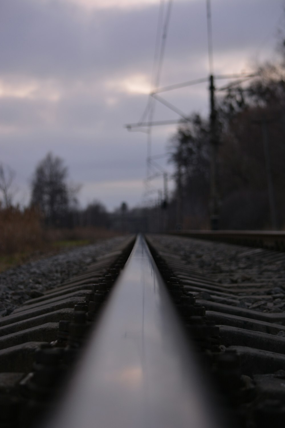 a train track with a sky in the background