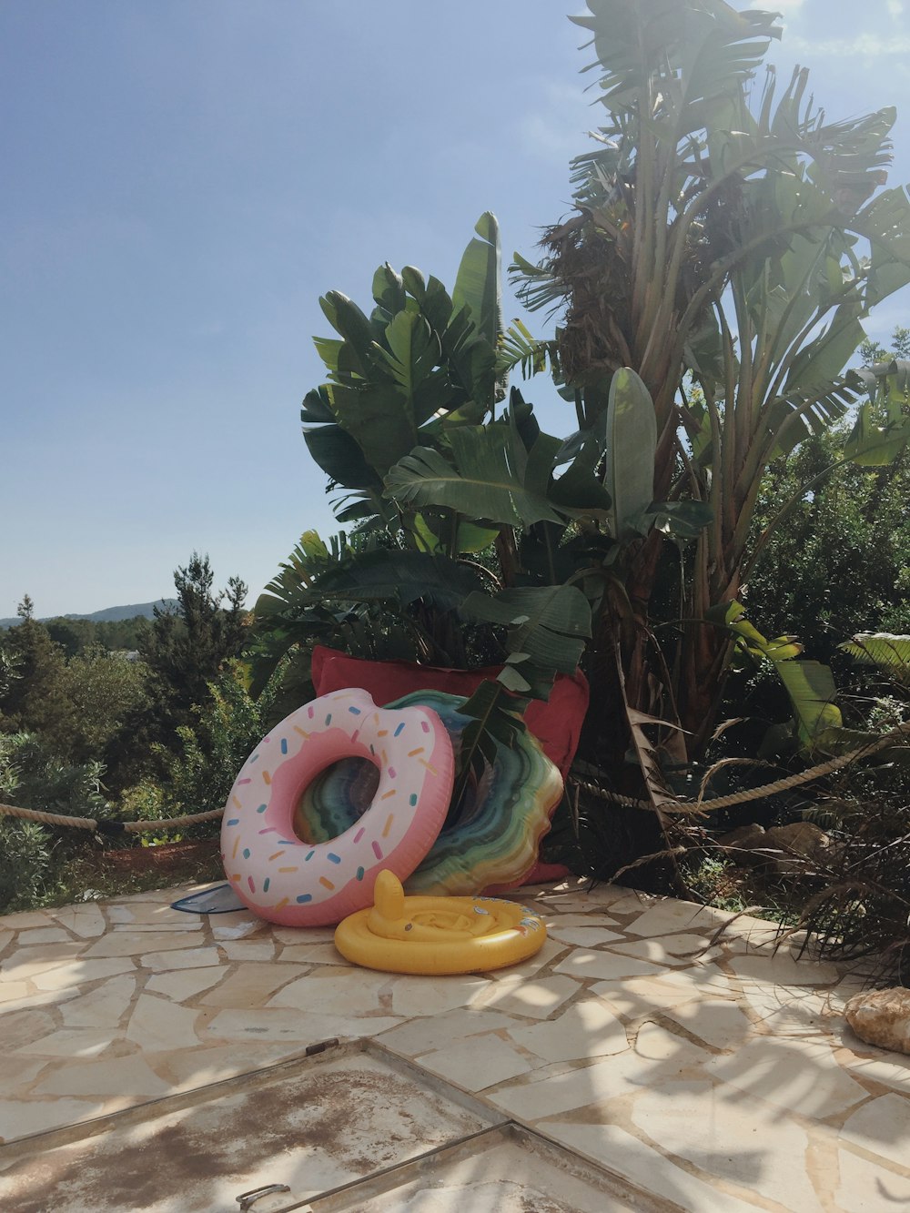 a pair of inflatable donuts sitting on a patio