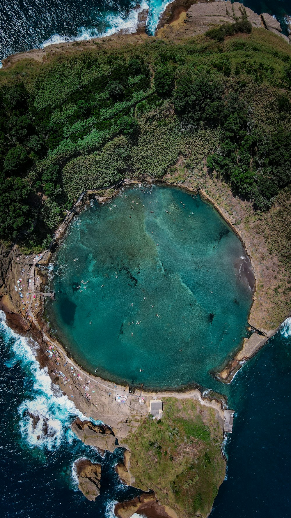 an aerial view of an island in the middle of the ocean