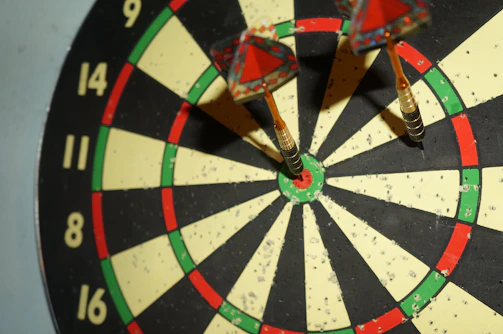 A target with several arrows clustered near the bullseye, showing skillful aim.