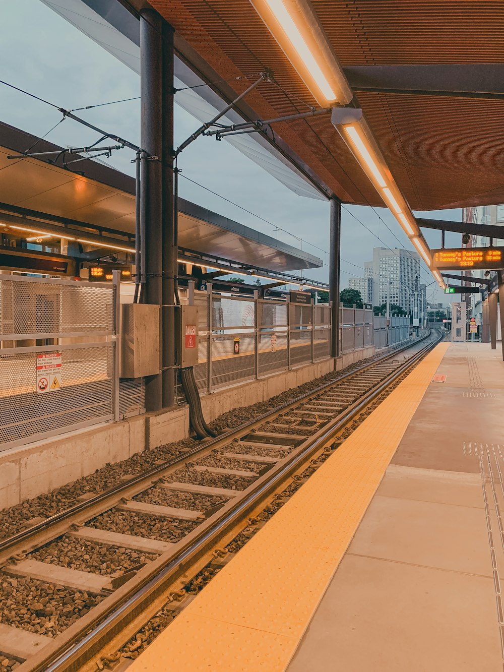 a train station with a train on the tracks