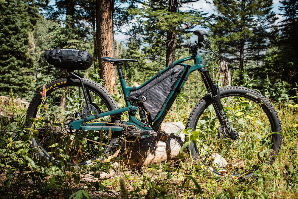 a mountain bike is parked in the woods