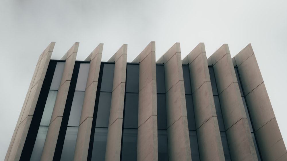 a tall building with a sky in the background