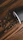 Close-up of a twistara tumbler resting on a wooden table with coffee nearby