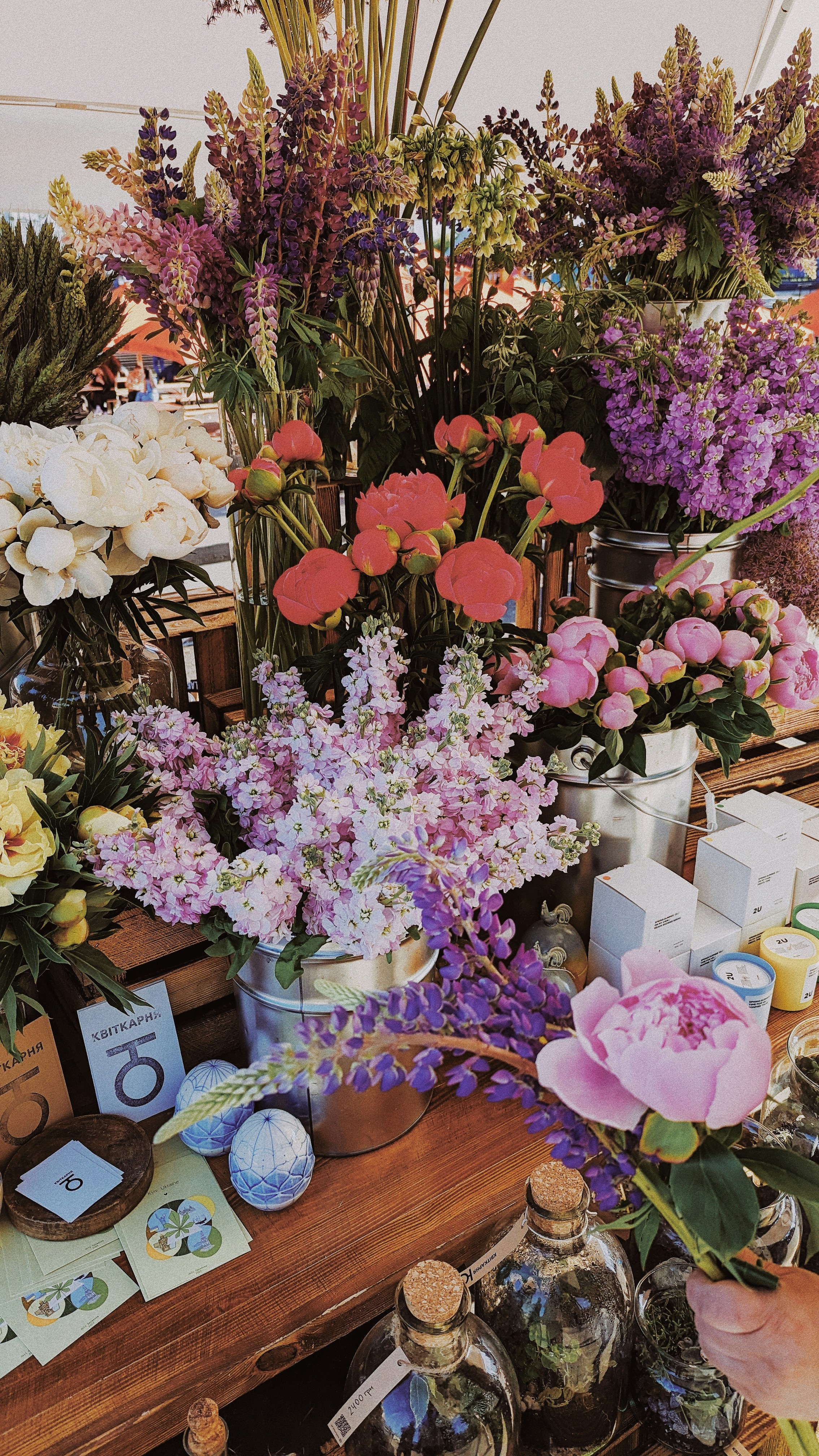 a table topped with lots of different types of flowers