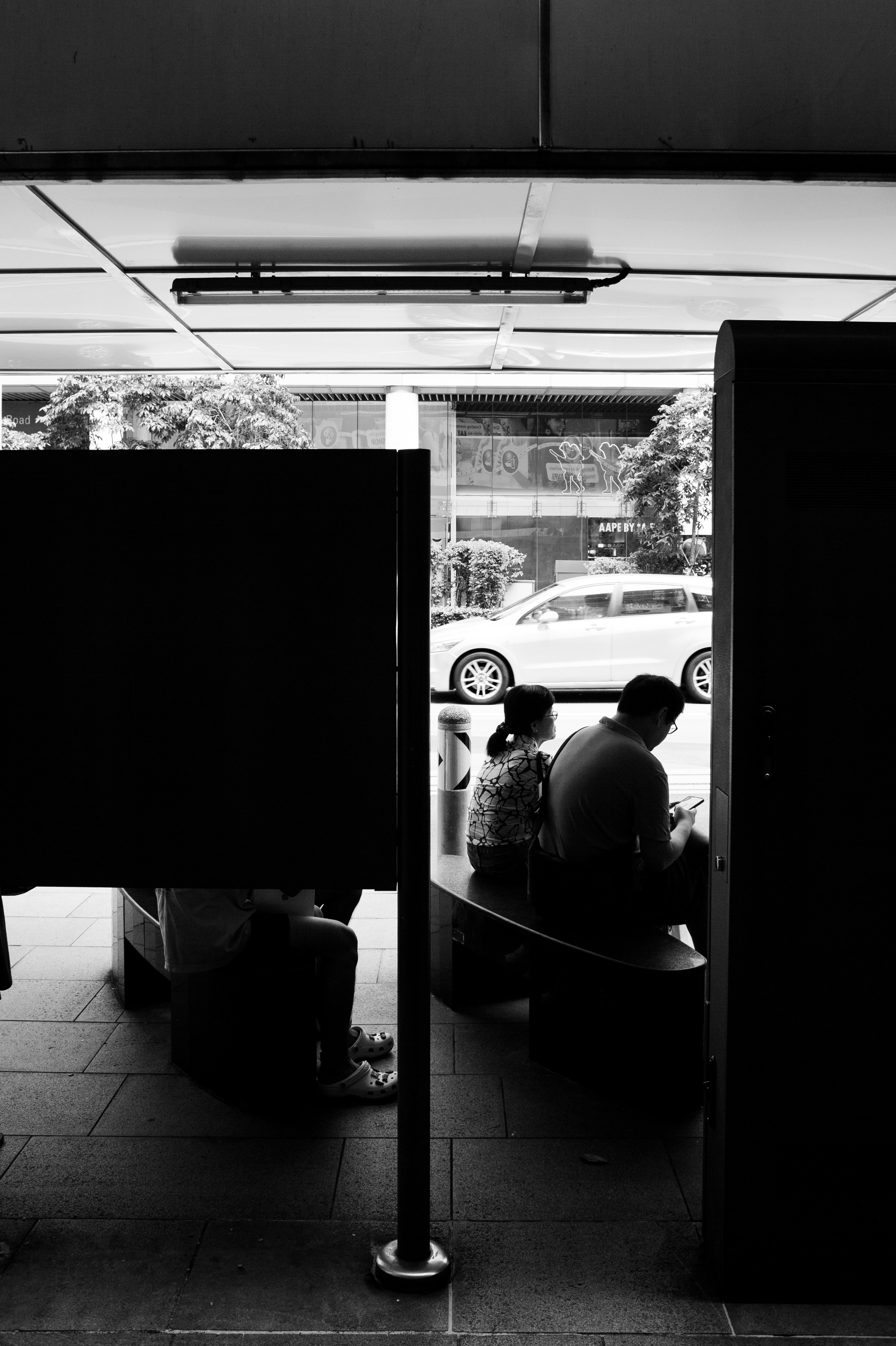 a couple of people sitting on top of a bench