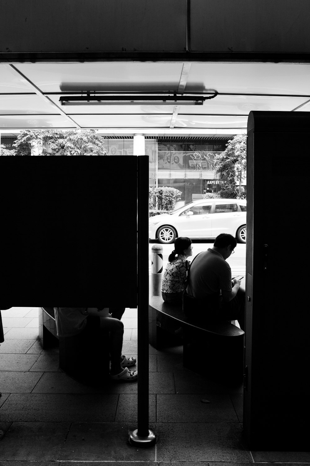 a couple of people sitting on top of a bench