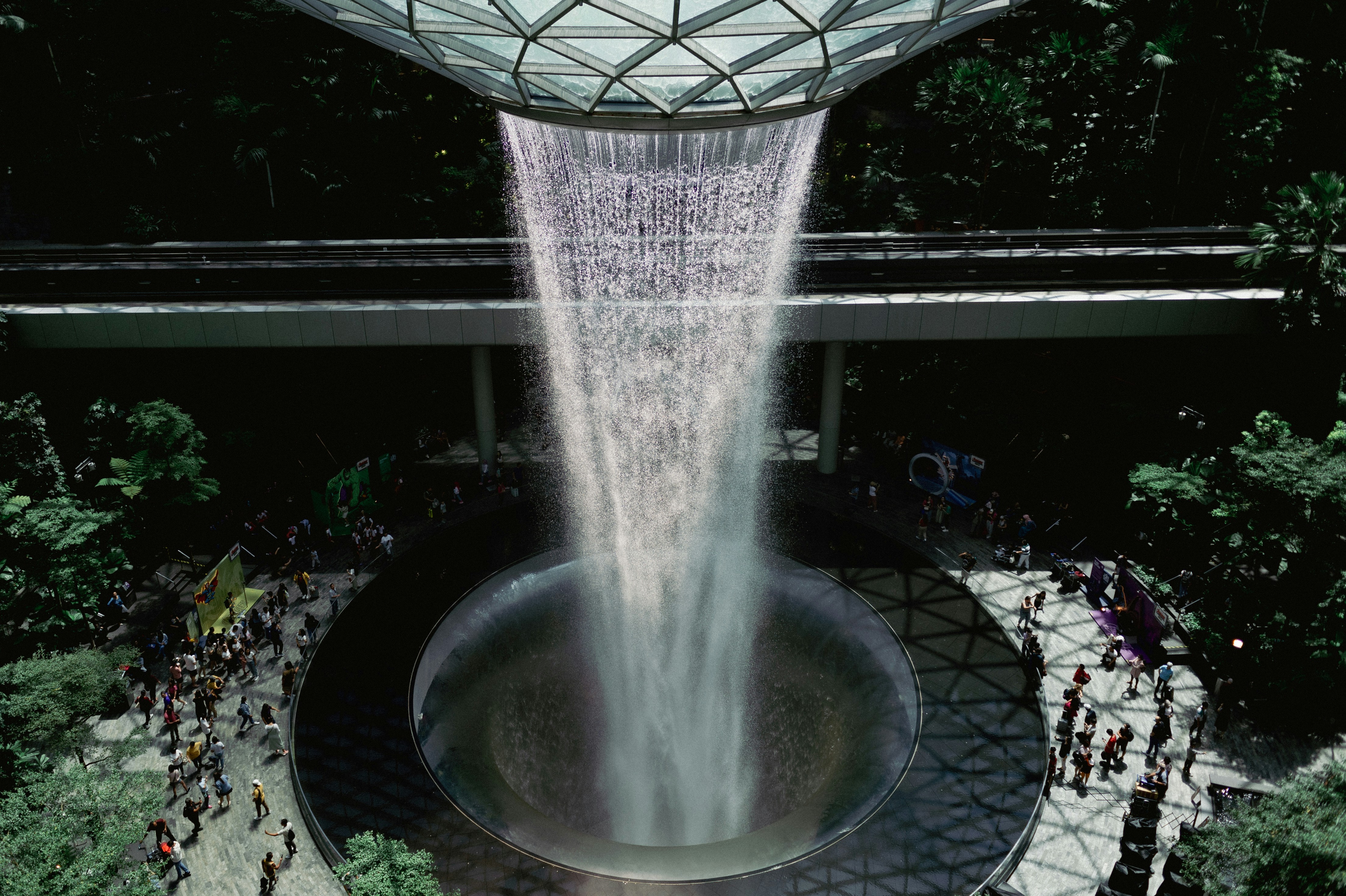 a large waterfall in the middle of a forest