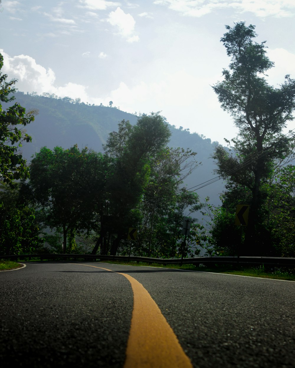 a road with a yellow line on the side of it