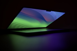 An open laptop displaying a weather atlas widget with colorful weather patterns