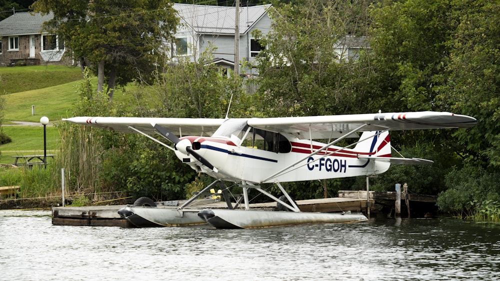 a small plane sitting on top of a body of water