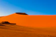 a large sand dune in the middle of a desert
