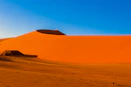 a large sand dune in the middle of a desert