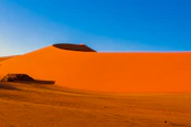 a large sand dune in the middle of a desert