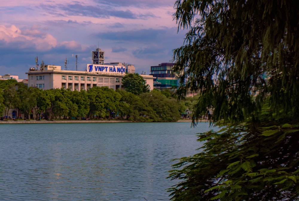 a large body of water with a building in the background